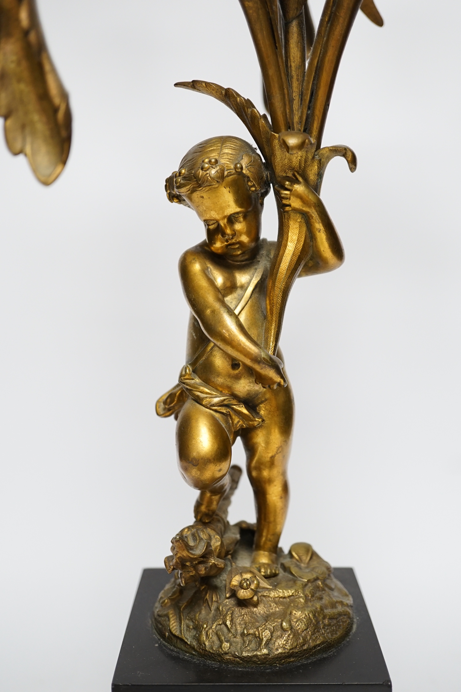 A 19th century ormolu and slate cherubic candelabrum, 58cm